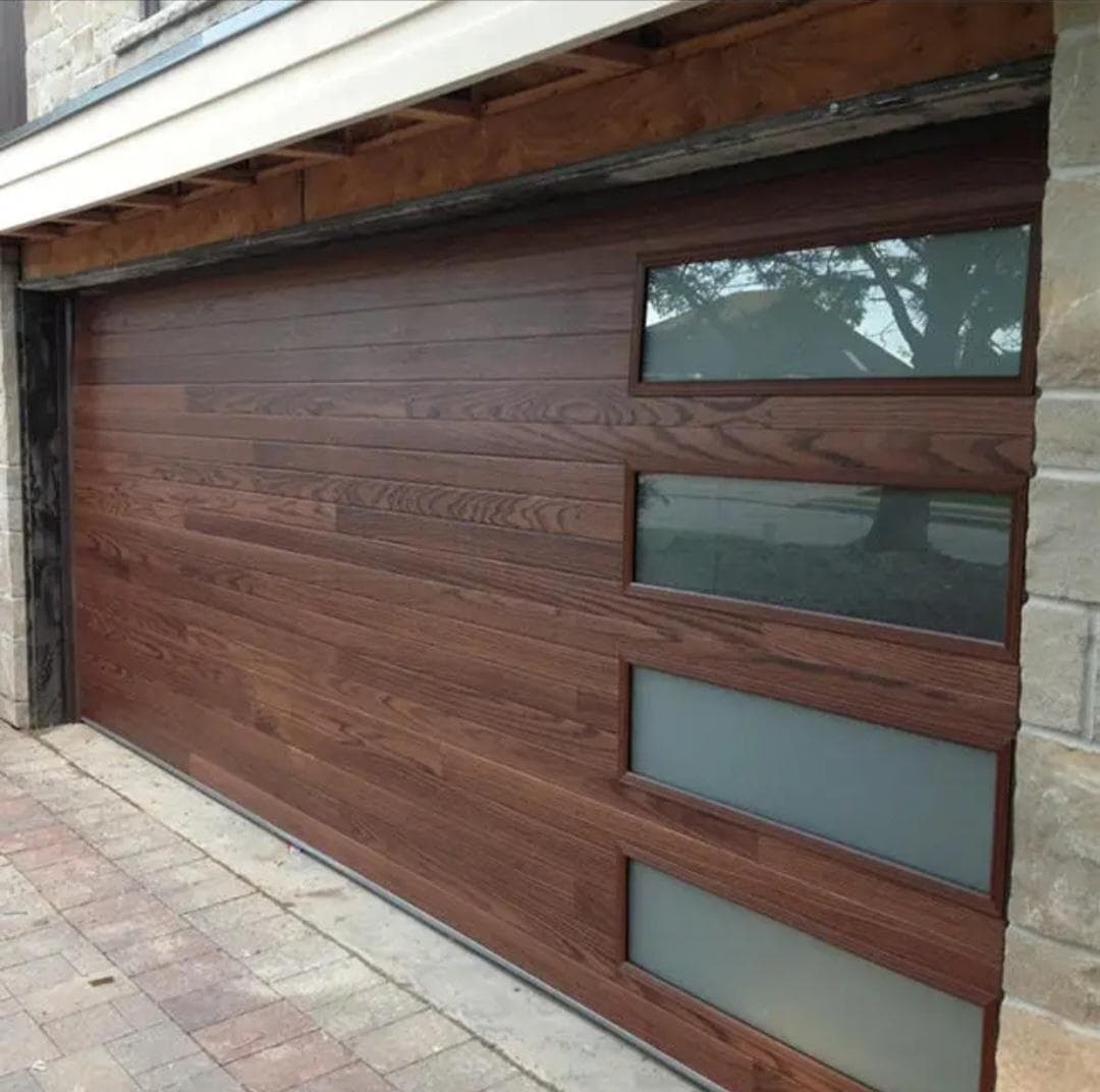 Custom stained wood garage door installed by Asmara Garage Doors in Edmonton